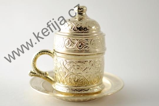 Rytinami zdobená sada v barvě zlata